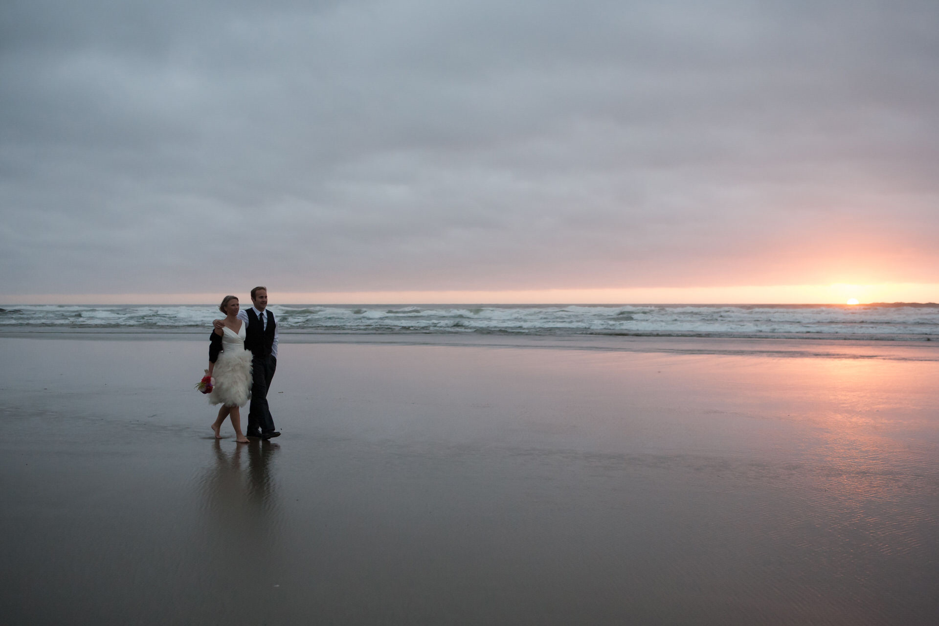 bride and groom on the beach by newport wedding photographer Alison Smith Thistledown photographer