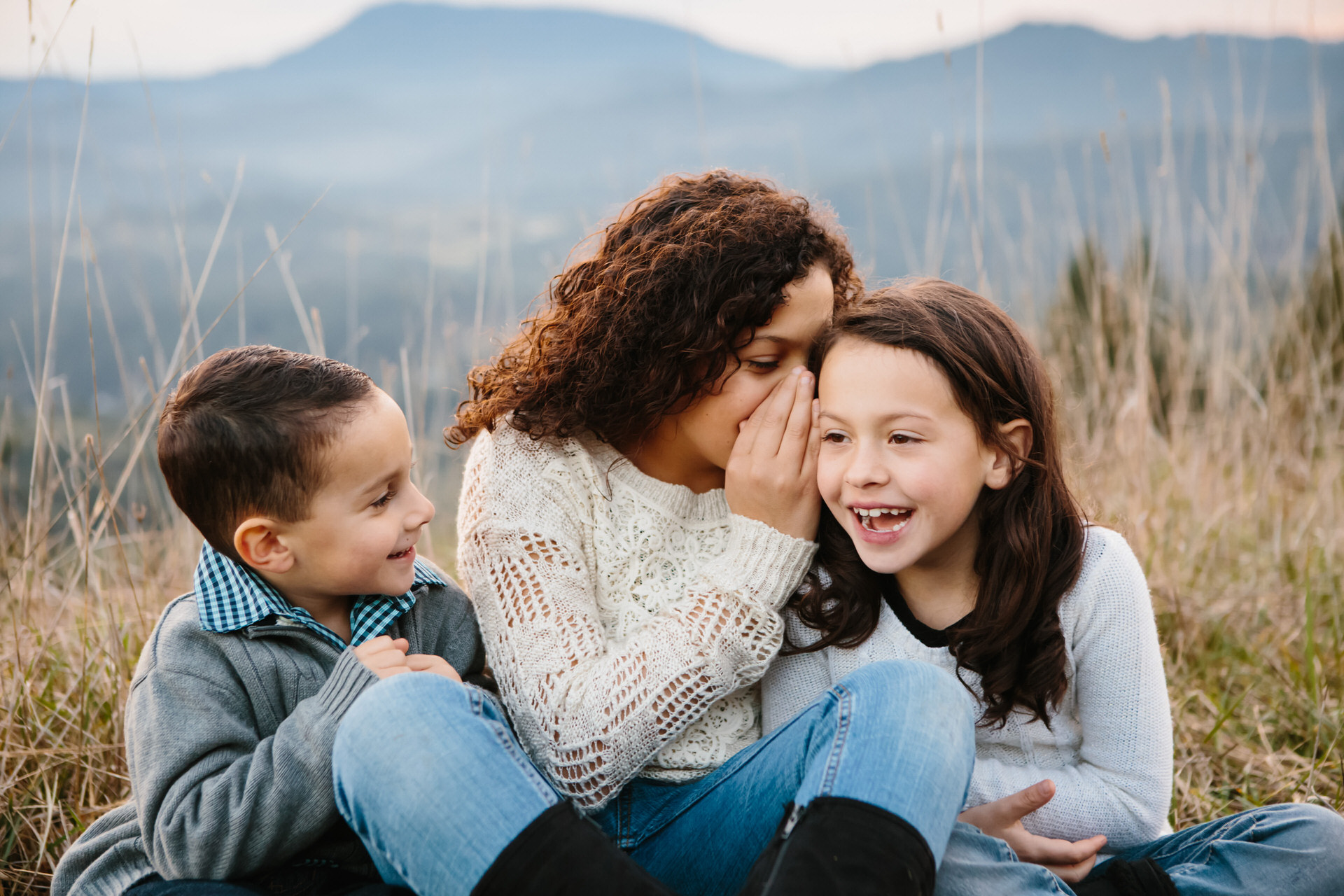 Family portraits outdoors with mountains by photographer Alison Smith Thistledown Photography