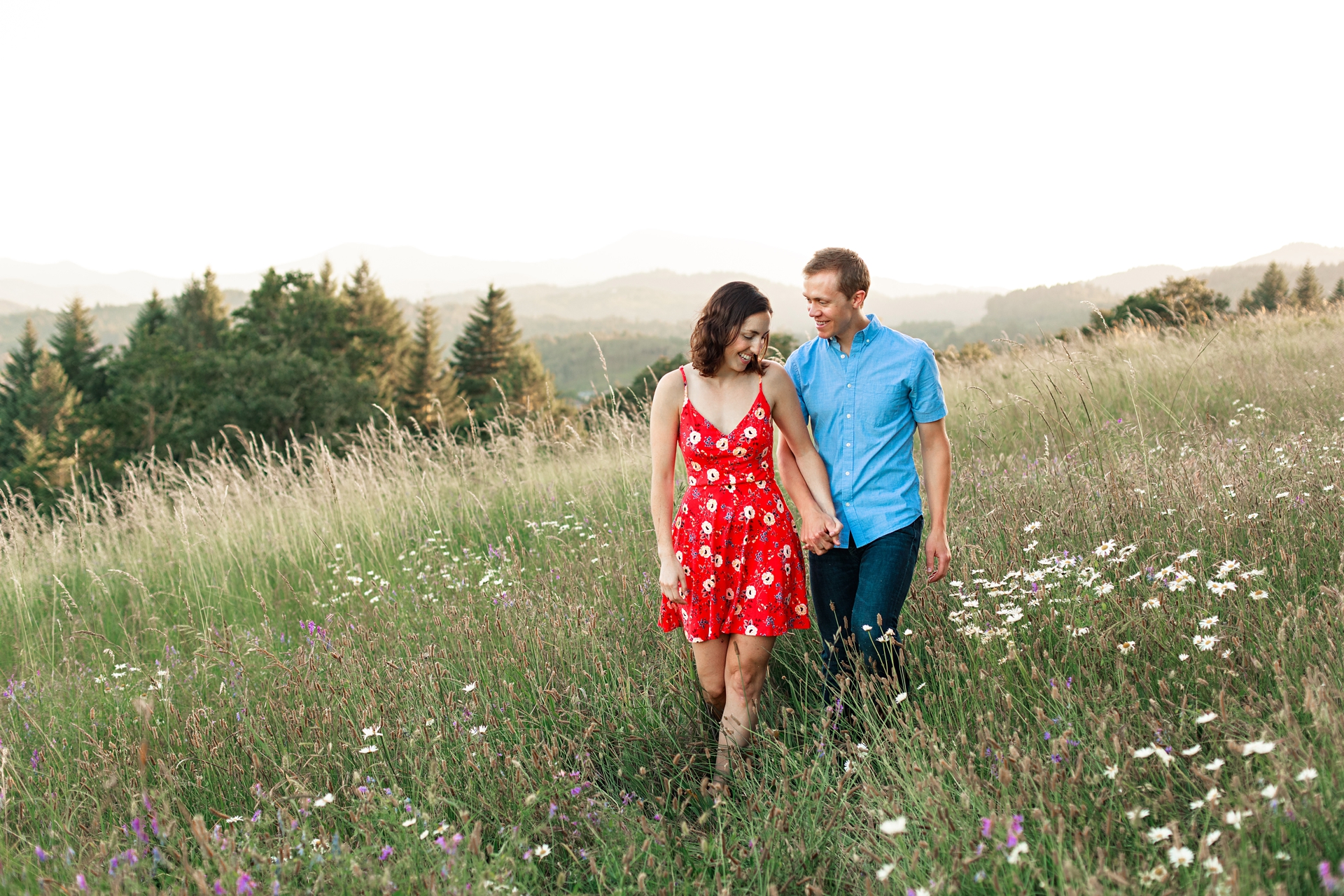 Engaged couple on a hill side at sunset in Corvallis Oregon by thistledown Photography